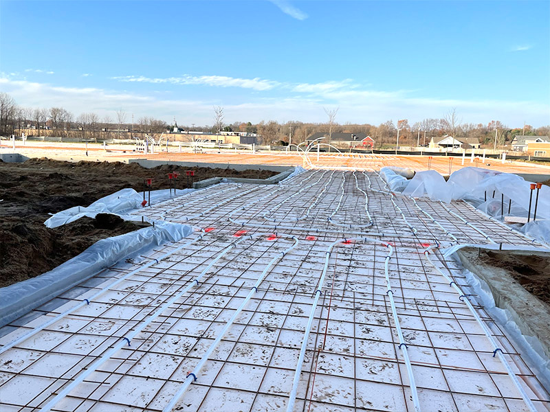 in-ground radiant heating system heating system being laid in foundation of new building