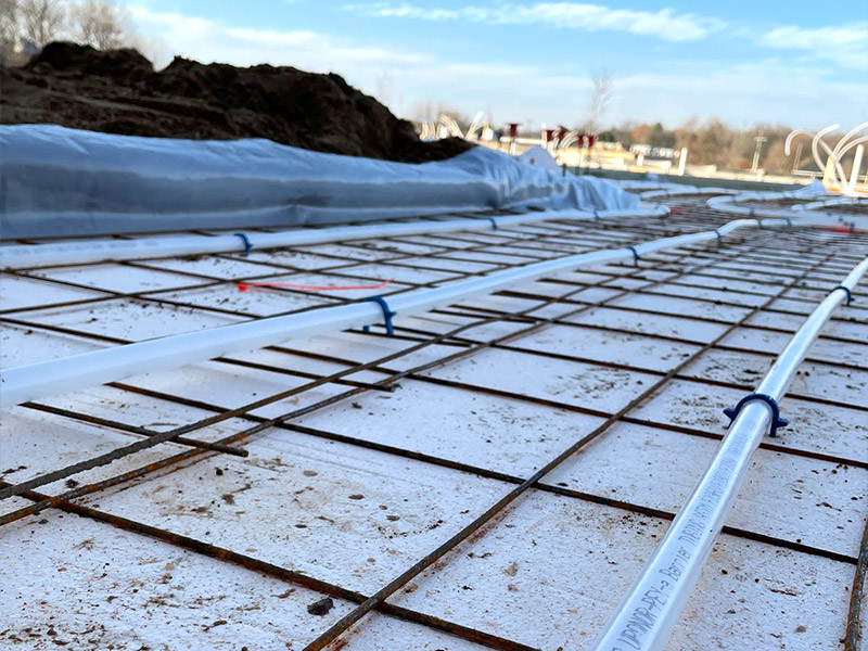 in-ground radiant heating system being laid in foundation of new building